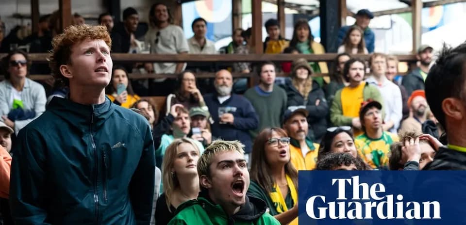 A crowd watching a sports event in excitement