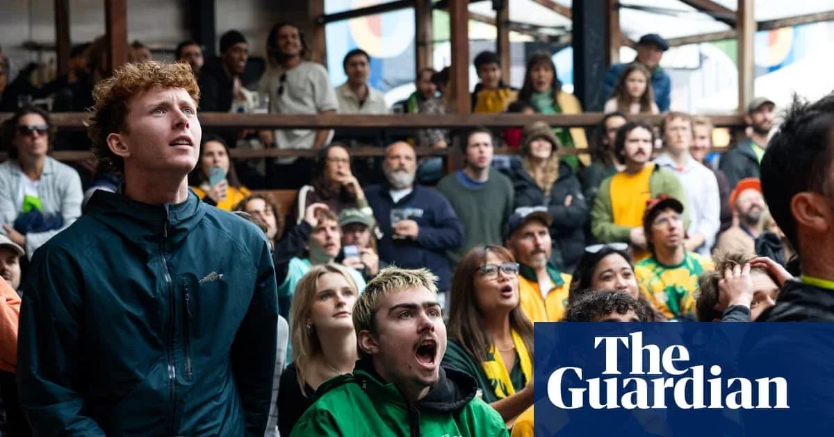 A crowd watching a sports event in excitement
