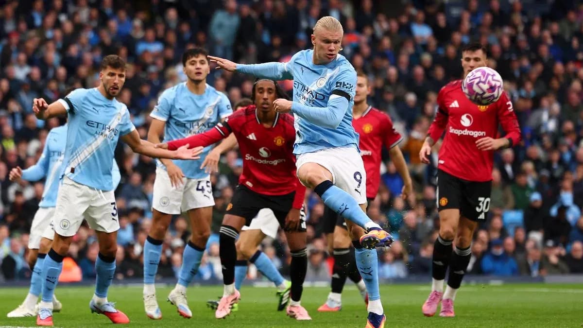 Erling Haaland kicking the ball during Manchester derby