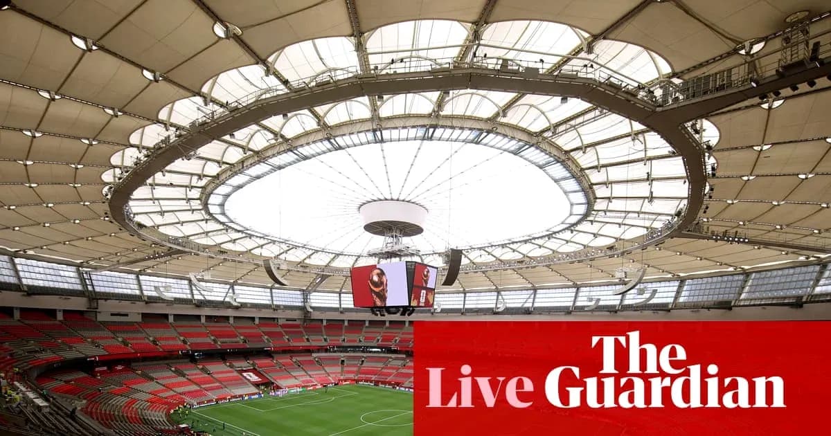 Interior view of stadium with large roof structure