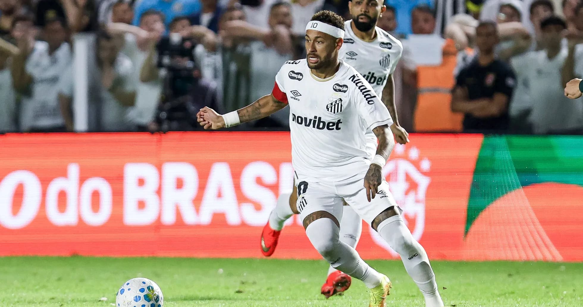 Neymar dribbling the ball during a match Neymar dribbling the ball during a match