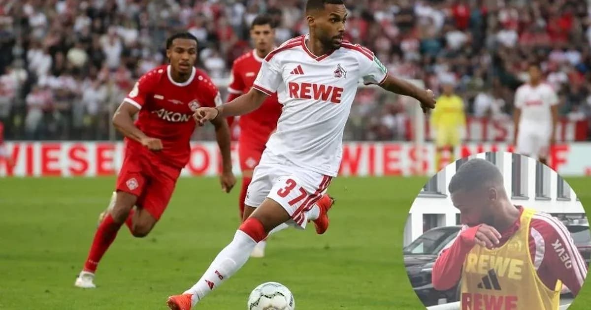 Jugador de Köln corriendo con el balón en partido Jugador de Köln corriendo con el balón en partido