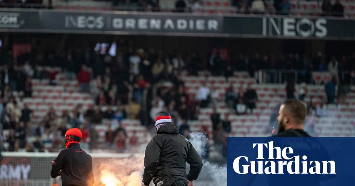Aflare ignited by fans during a football match Aflare ignited by fans during a football match
