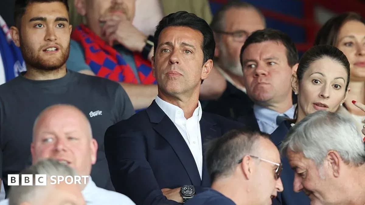 A group of spectators watching a match in stands A group of spectators watching a match in stands