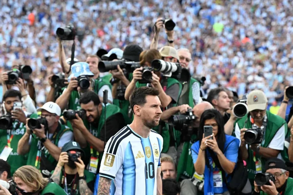 Lionel Messi surrounded by photographers after match Lionel Messi surrounded by photographers after match
